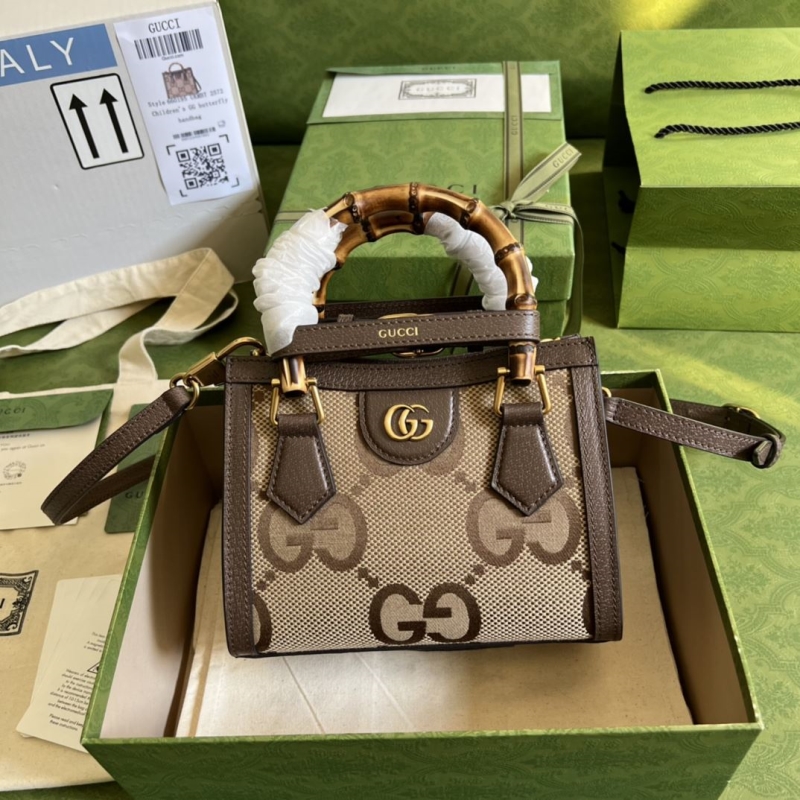 G*u*i top handle bags